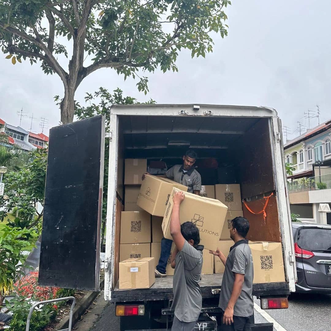Moving crew handling items at a truck